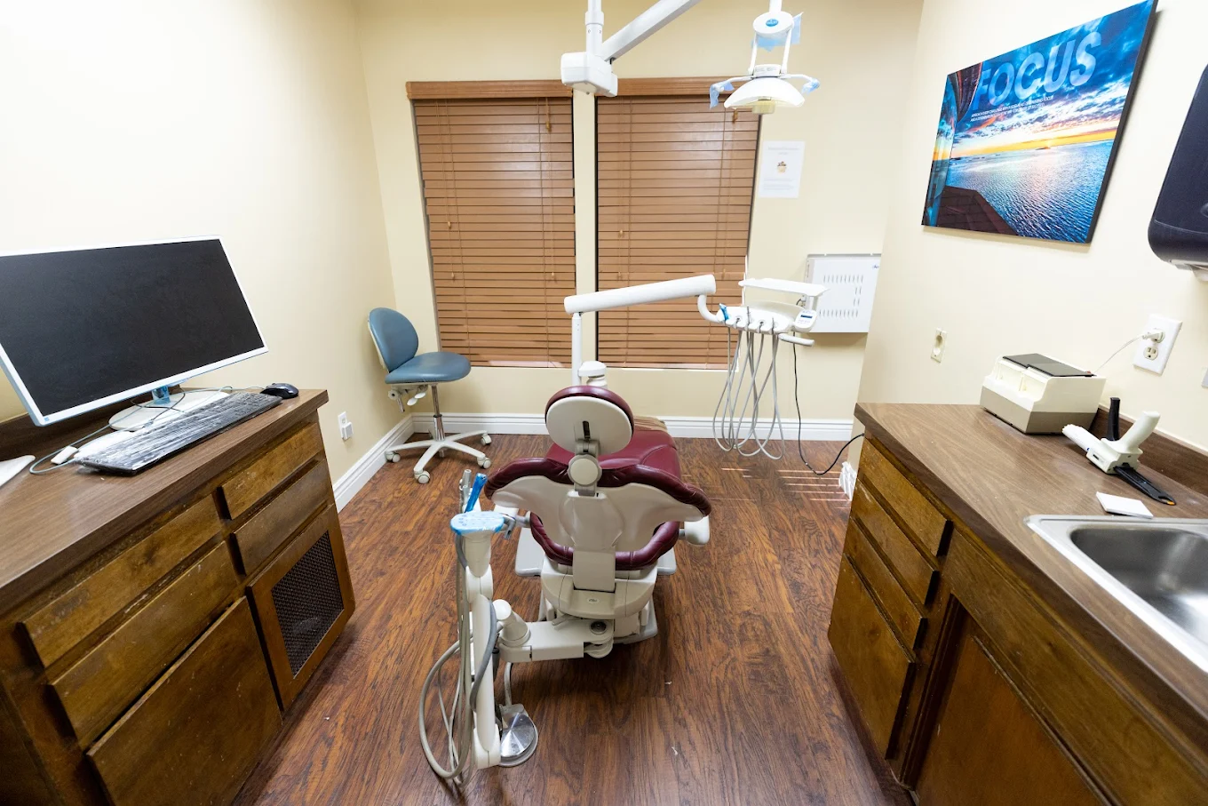 Karas Dental Care operatory with overhead light and tidy equipment